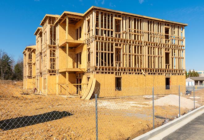 a close-up of temporary chain link fences enclosing a construction site, signaling progress in the project's development in Glen Rock NJ